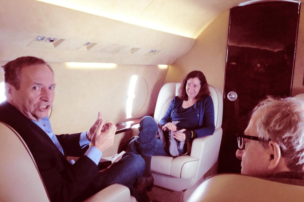 Jeffrey Epstein photographed with two high-profile individuals in what appears to be a professional or public environment.