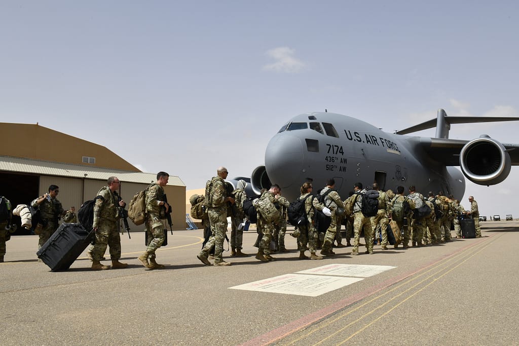 U.S. military personnel board a U.S. Air Force aircraft during a deployment related to counterterrorism operations