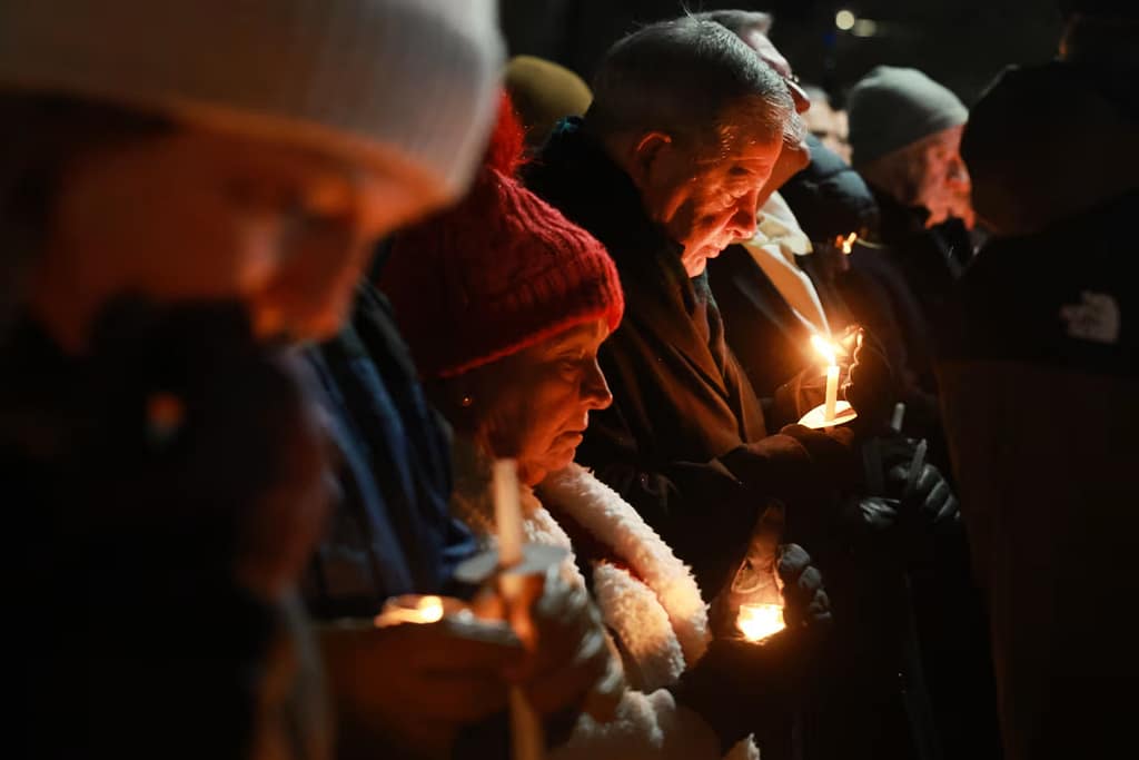 People gather for a candlelight vigil on Sunday in Providence, Rhode Island.