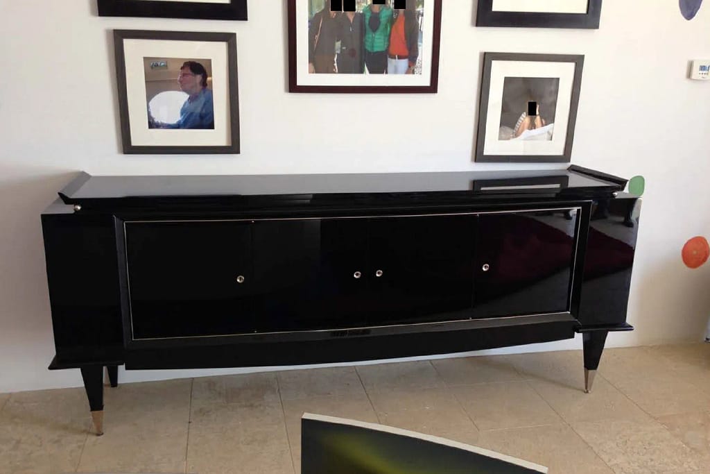 Candid-style photograph of Jeffrey Epstein posing with a woman whose face has been obscured for privacy.