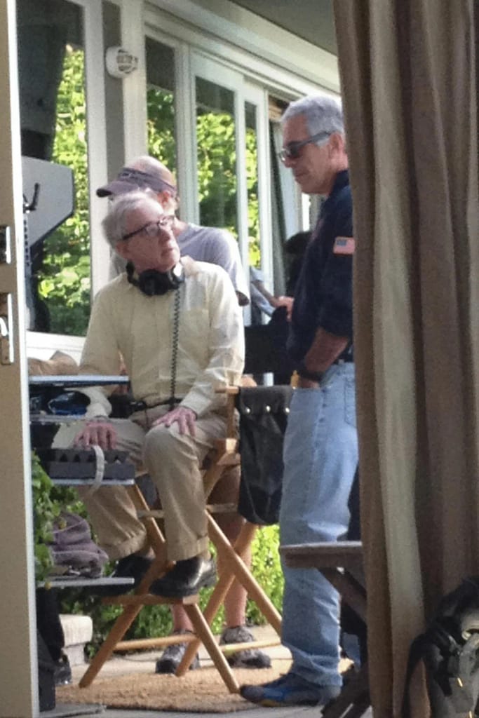 Jeffrey Epstein and a public figure seated next to each other during a social interaction.