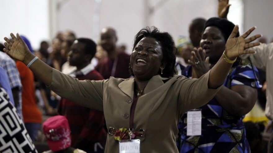 Nigerian Christians pray and worship during a church gathering amid ongoing security concerns